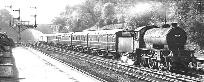 Hessle near Hull. D49/1 62720 'Cambridgeshire' with suburban passenger working. Cinder ballast. Note also late LNER type triple doll bracket signal at the left .