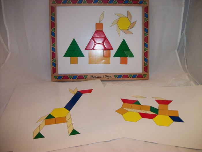 Melissa & Doug pattern block are magnatized and stay in place. Comes with picture plates to copy.