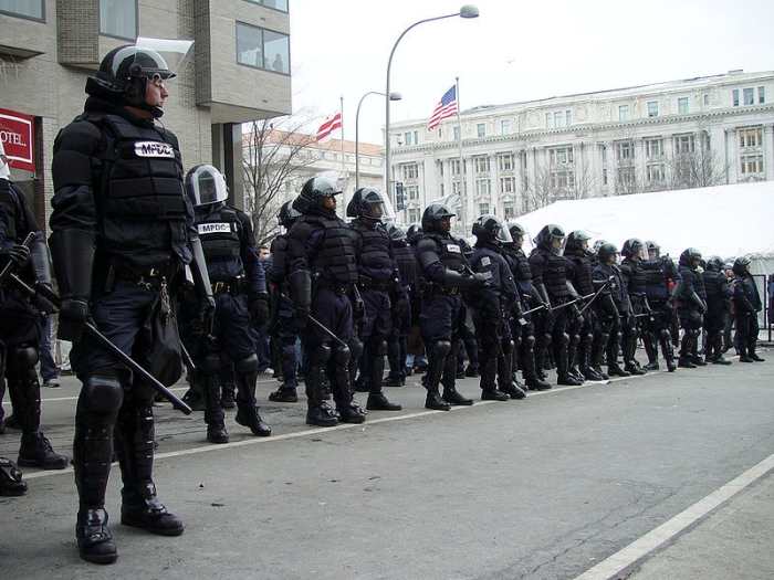Police in riot gear blocking a checkpoint into the parade route at Bush's 2nd inauguration, Washington DC. 20 January 2005