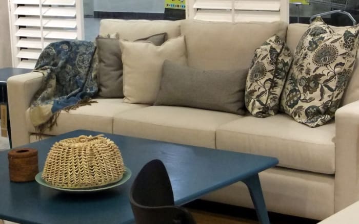 9. Notice how different colors, fabric design and throw pillow sizes blended well, making a dull sofa, interesting.