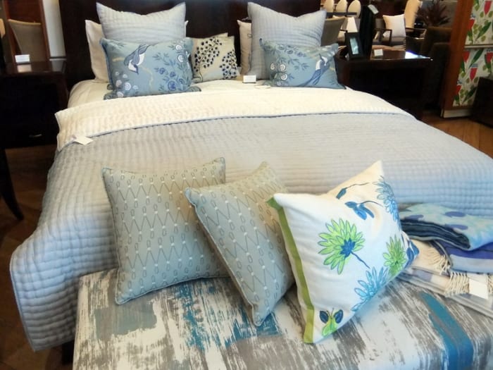 15. In this bedroom, the color scheme for the decorative throw pillow matches, but in different fabric design