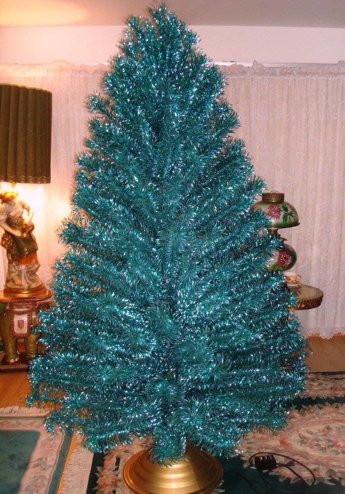 The vintage emerald green blue seven foot stainless aluminum Holiday Christmas tree. This is a most have for a true vintage tree lover.
