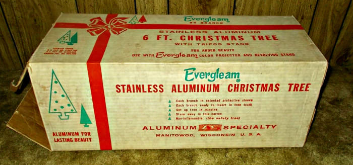Has the original instruction sheet and a store advertising hang card, as it was used as a floor display. That is probably the only time this beautiful Silver Aluminum Christmas Tree was ever used.