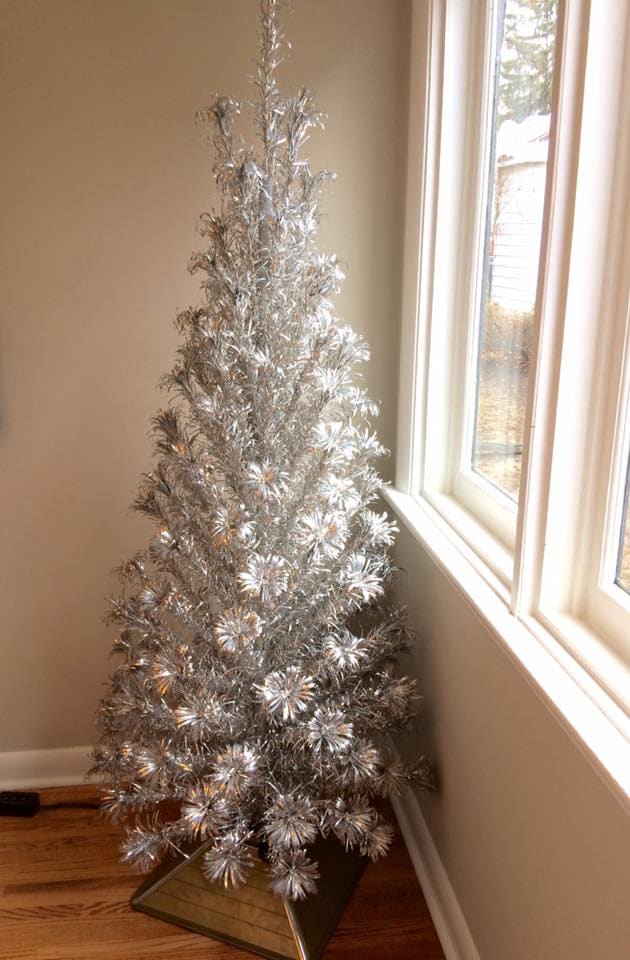 An early 1960s beauty, the Evergleam 121 branch "Slim Line" model aluminum tree I own. I think it looks good enough to leave with out decorations, this model was made for folks with limited space, such as apartment dwellers, and is very well made.