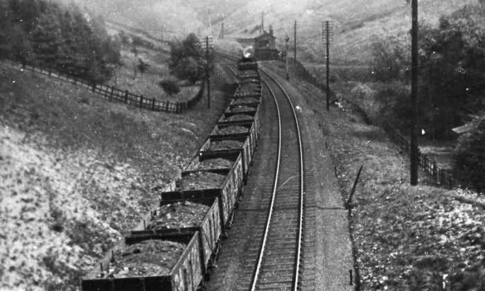 Laden coal wagons pass Weedley on the way to Hull docks for export to the Continent - a large amount of coal traffic went this way from the old West Riding collieries (now South Yorkshire, incorporating Sheffield and Doncaster as the main towns)