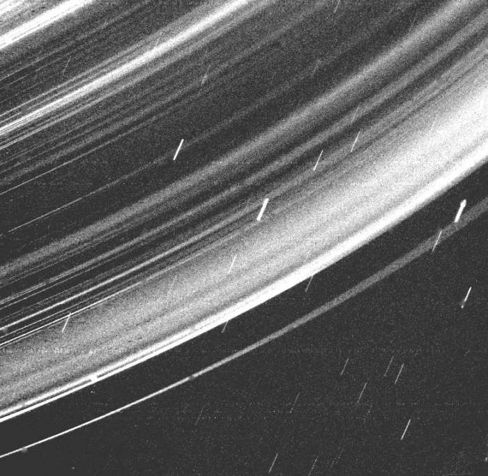 This closeup view was provided by the Voyager 2 flyby in 1986. The small streaks that aren't a part of the rings are star trails.