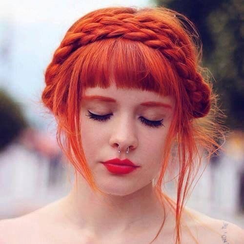 most innocent hairdo style with a braid on top of the head like a hair band and straight bangs. Stunning orange red hair