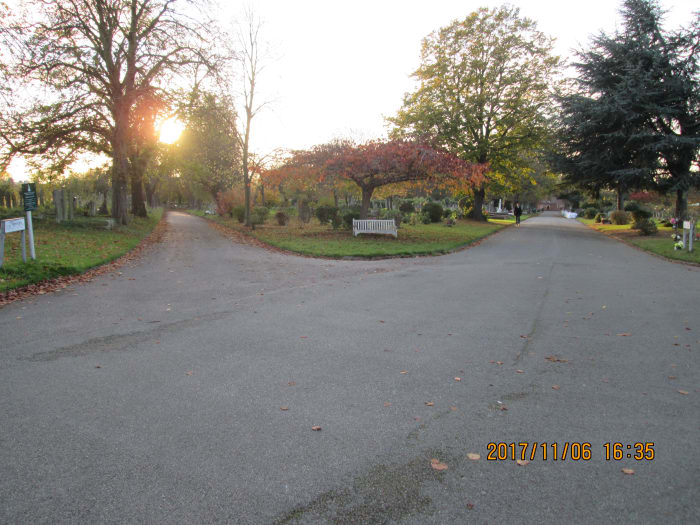 The parting of the ways. To the left is the road that skirts the cemetery railings on the railway side. Ahead is the direct road past the chapel to the Sebert Road gates