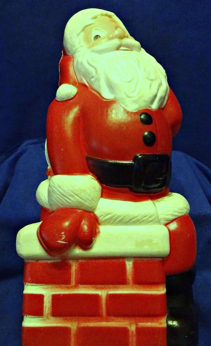 The Happy Santa Claus sitting on the chimney was made by General Foam Plastic back in the late 1960's.