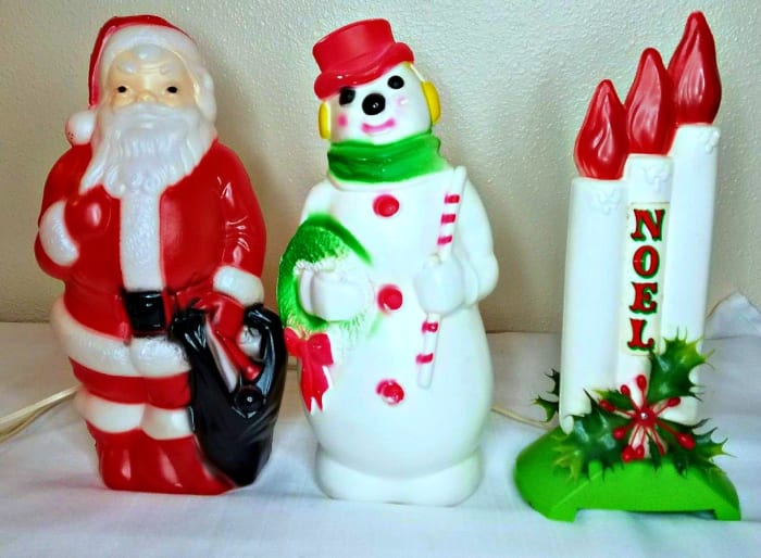 Three beautiful and well made Empire Blow Molds, Santa Claus, Snowman and a beautiful window Noel Blow Mold Candles display. They are between 13 inches tall 14 inches tall.