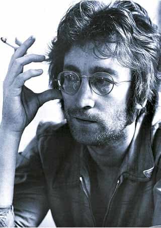 John Lennon Pilgrim of Peace - black and white photo with cigarette in hand and wearing his iconic glasses