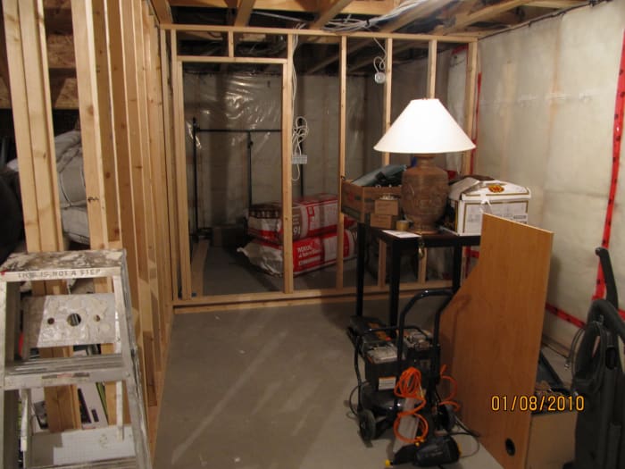 Notice the bottom of the wall. It is floating. There is a plate secured to the concrete and then a plate floating an 1 1/2 above it.