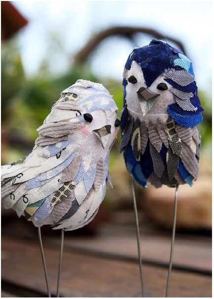 These are actually cake toppers, but they would be just as cute as decorations for a table, windowsill or mantelpiece. You just need to shape the bodies out of clay, paper mache, foam or other material, and then decorate them.