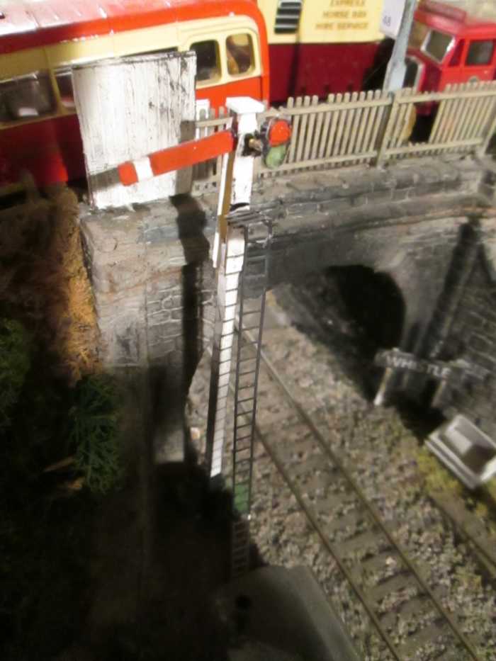 Ayton Row down starter with sighting board beside the road bridge - 'capping' replaces original post-top finial