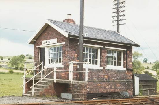 Leyburn Signal Cabin (demolished) on the Wensleydale Railway was a regular NER Southern Divison cabin with a token exchange platform added on to the access steps