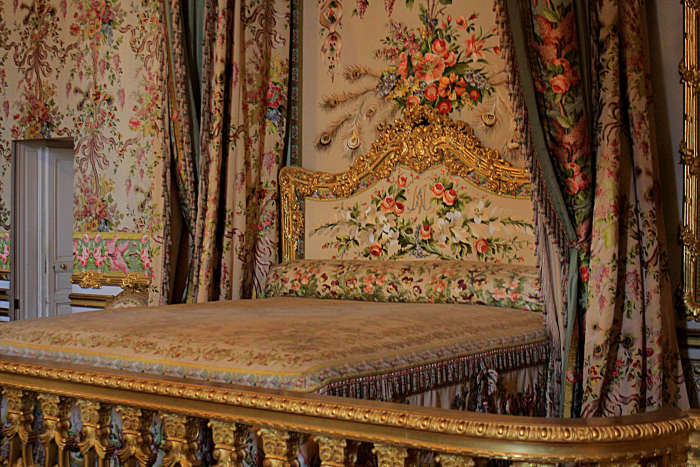The Queen's Chamber and bed where successive queens slept over 100 years. The last occupant was Marie-Antoinette who (briefly) escaped from the Palace during the revolution via a small door on the left of this room