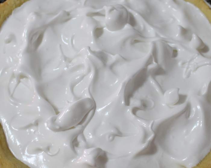 Top with meringue; meet the crust all the way around and your meringue won't sink away from the pasty