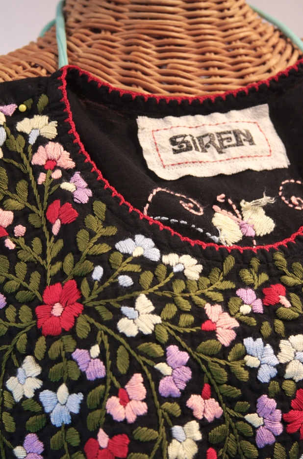 Lots of colorful floral embroidery is the hallmark of 1970s style Mexican peasant blouse finery.