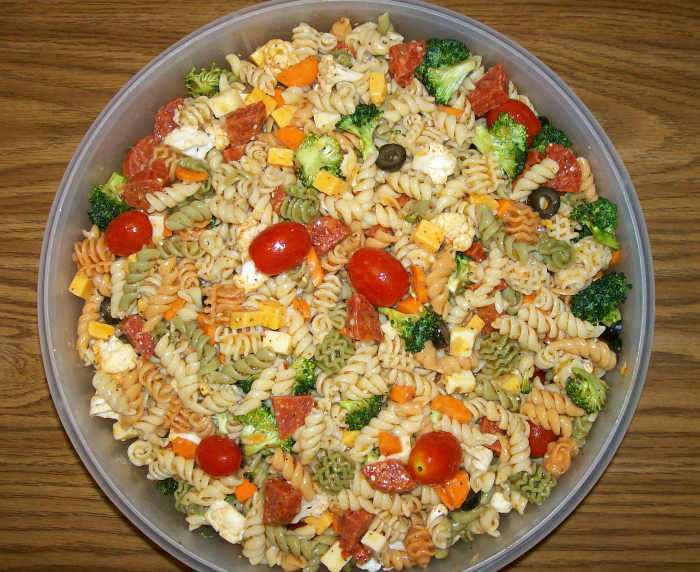 I mixed everything in a large Tupperware "That's a Bowl" and then transferred the final Supreme Pasta Salad to a pretty, green glass bowl.
