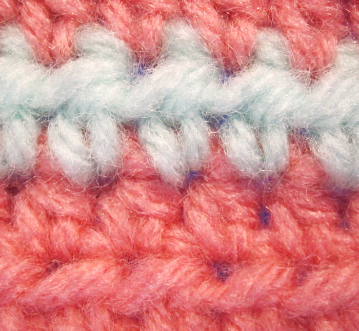 Is it just me or do the blue stitches look like people dancing in a line? half double crochet stitches.