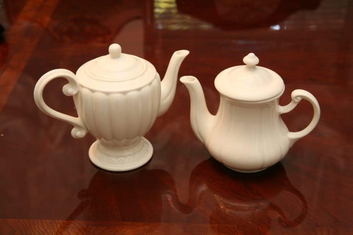 Victorian teapots gracing a table. This is what you use for teaparties with little, matching cups from which you sip with pinky finger aloft.