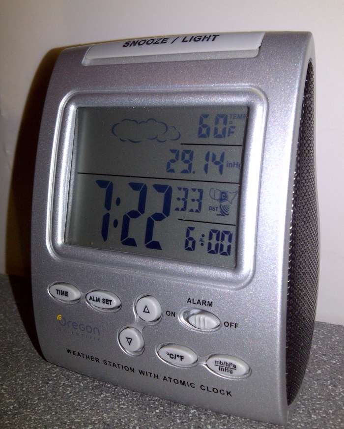 Oregon Scientific alarm clock with barometric pressure sensor and thermometer provides weather forecasts
