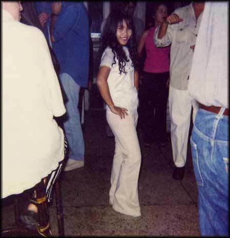 Loon, aged 15, waits for customers in a Bangkok nightclub two years after selling her virginity for a few hundred dollars