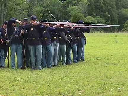 A Living History Unit prepares to Fire By Rank: the Front Rank Aims while the Rear Rank Loads (it already fired its volley)