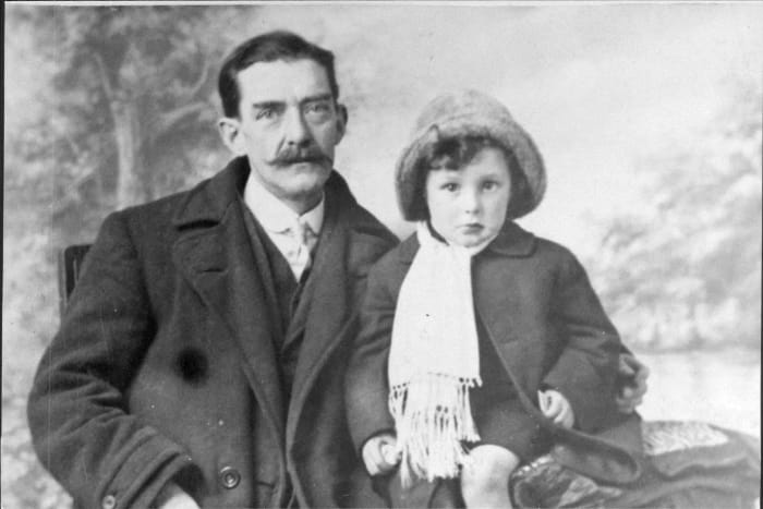 Grandad's father with daughter Mary Triggs. This appears to be a posed photograph taken in a studio.