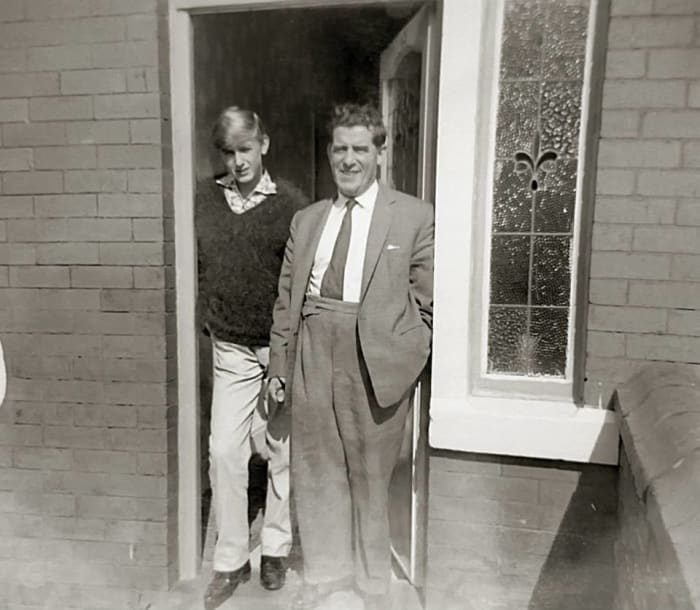 Grandad with my brother Eric at the house where we grew up. Grandad is dressed as I remember him, always in a suit and tie and never 'casual'.