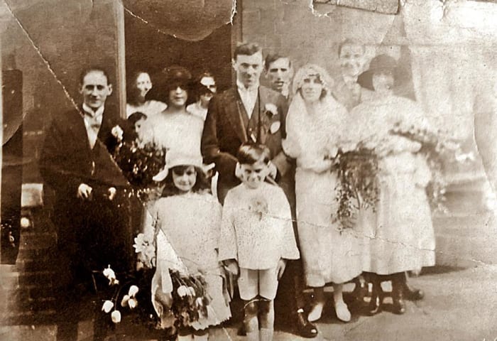 Grandad's sister, Annie Triggs, on her wedding day to John Willie Peck. Annie's sister Mary and her husband Bob Copley are to their left, behind the children. Their older brother Arthur is at the back, behind the bride and groom.