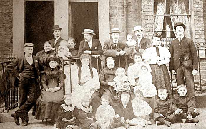 This photo shows the Triggs family, pre-1910. Grandad is one of the little boys sitting on the front row. His father is standing at the back, far right. My great, great grandma is the lady in black, sitting in the centre.