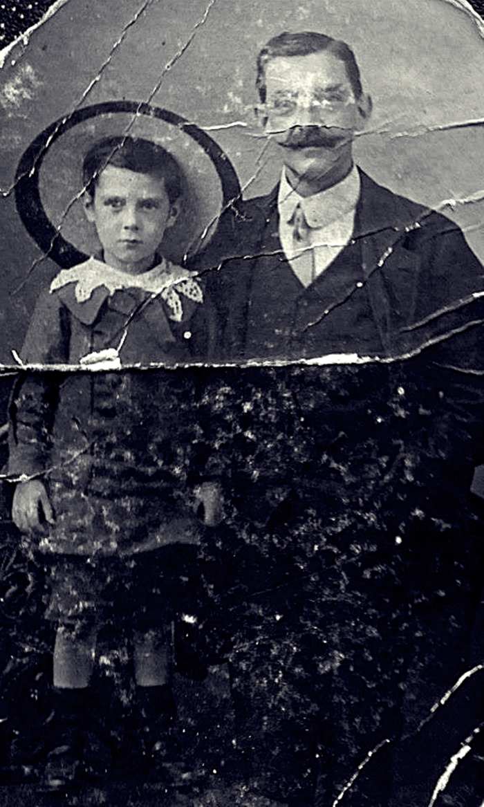 Grandad as a young boy in around 1910, pictured with his father, in a photograph staged at a studio. They are wearing their "Sunday best", as a photo like this was a rare occurrence.