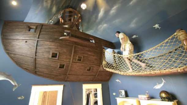 Crows nest bed with rope planked walkway to board the ship. Any kid would want this in their bedroom.