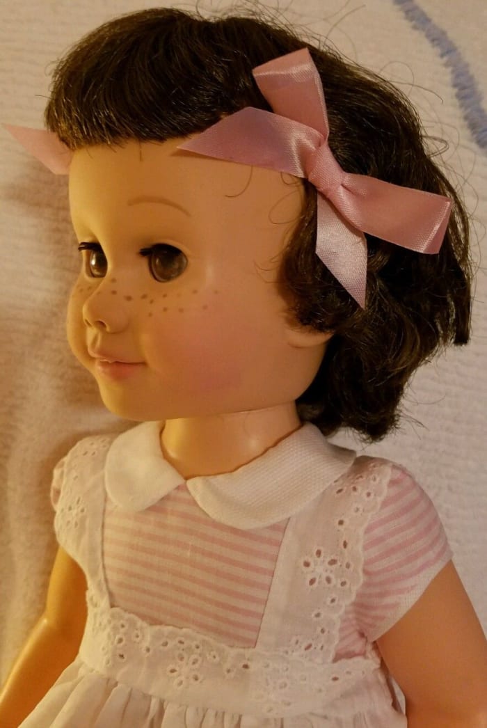 This vintage Chatty Cathy has excellent hair in original set, and her lashes are also excellent. Freckles and face paint excellent original. Head limbs same color, which is always a plus. .