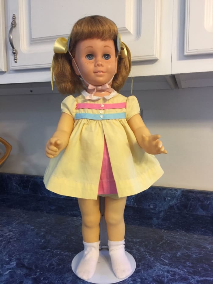 Mattel Chatty Cathy she is a original 5th Issue 1962-1964 with blonde hair and blue eyes. She is in her Nursery School dress; with blonde pigtail hair style ...
