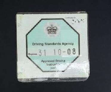 Fully qualified Approved Driving Instructors (ADIs) display a green octagonal badge