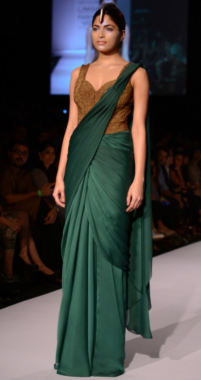 Bottle green Shammo Silk Saree with full length stomach covered saree blouse with all over bronze beads