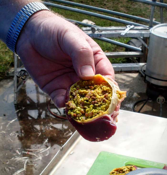 Cut open the gizzard on the side with the widest "hump". Try not to cut into the inner sac, as was done here.