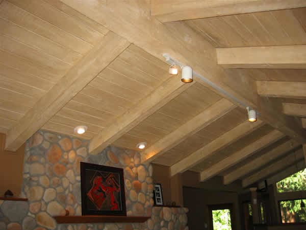 "Vaulted Ceiling" This vaulted and beamed wood ceiling had been painted a glossy white and the customer wanted to bring it back to a natural light wood color. We achieved this by applying a glazing technique, which gives the illusion of natural wood,