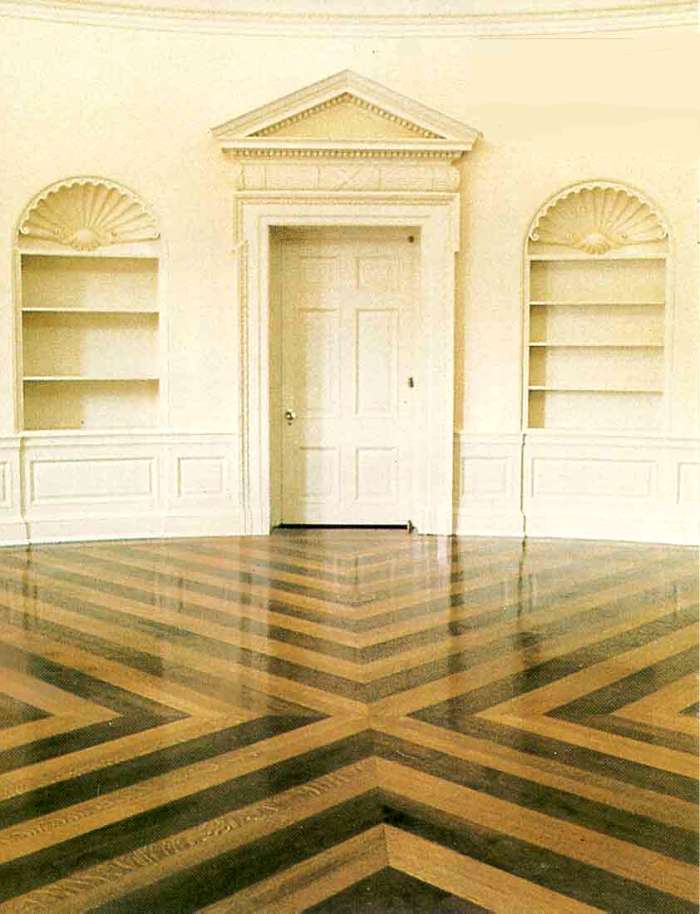 The Oval Office flooring was replaced during the Bush Administration. The floor, made of walnut and oak with its contrasting pattern was from a design by Eric Gugler, a White House architect during the FD Roosevelt years.