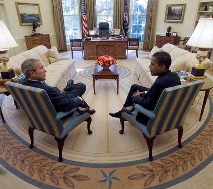 President Bush meets with President-elect Obama in the Oval Office. These blue and gold striped chairs were the center of many photographs that Bush had taken with Oval Office guests.