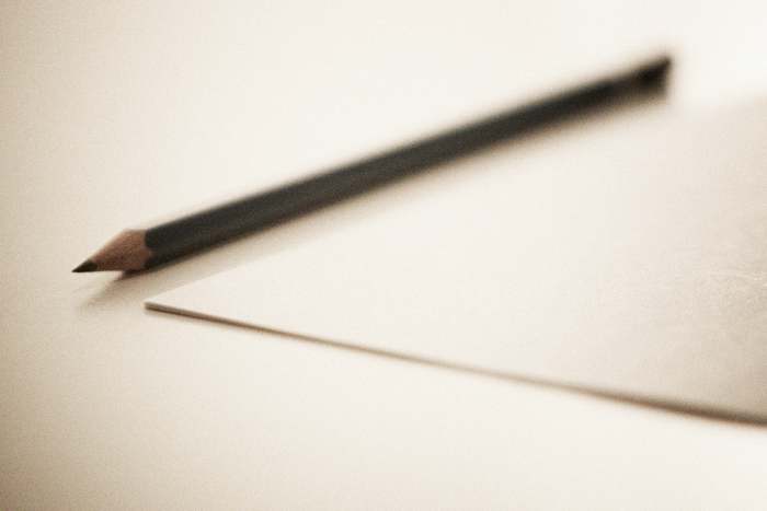 Sharpened Pencil next to a sheet paper, that is what you need to start playing. Image By Thomaseagle (Own work)