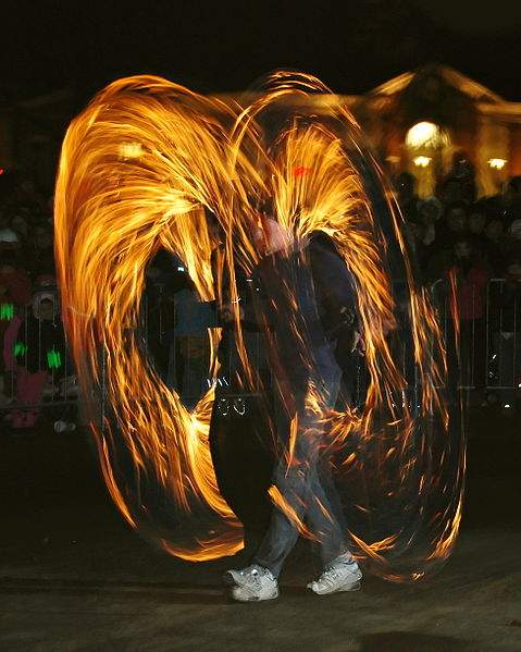 Poi is a form of juggling originated by the Maori people in New Zealand. This photograph of fire poi was taken by Paul Keleher on December 31, 2007.