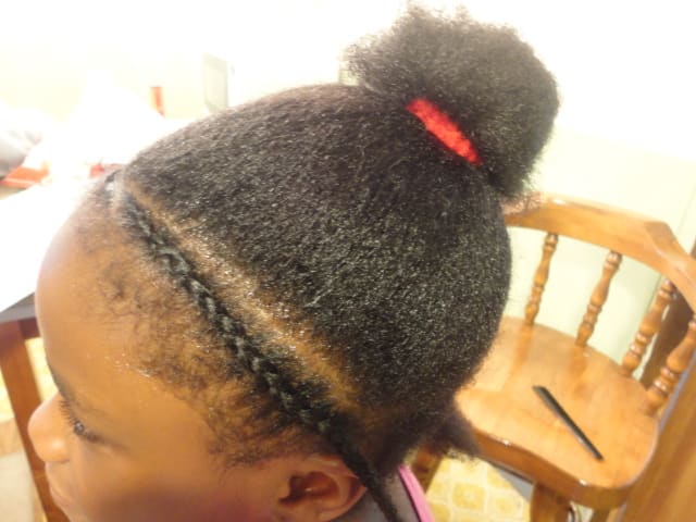 I started out by sectioning her hair into a top portion and a bottom portion at the nape of her neck.