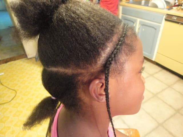 In this photo, you can see the back section. Her hair at different times in her life has been a little shorter in back so sometimes I will section that part, sort of away from the main design.