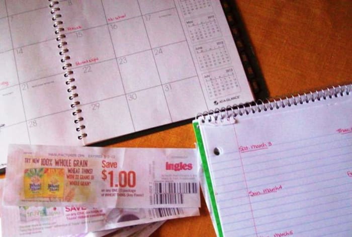 I'm gathering my materials to make my list. I have my weekly sales flyer open on my computer, I've got my calendar, my menu laid out, as well as some store coupons.