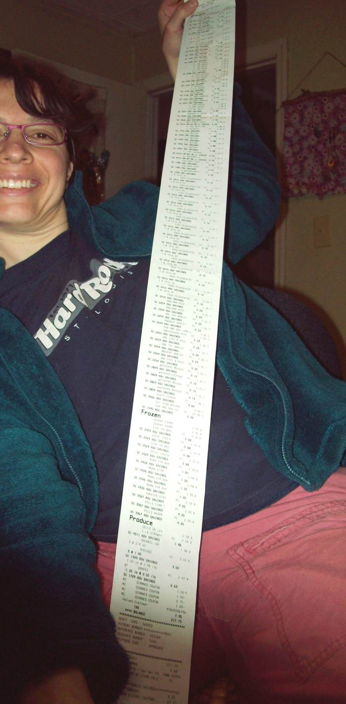 This is me happily holding a very long receipt...and I saved almost $74 on this trip, with no coupon clipping. I had only used a few coupons issued by the store.