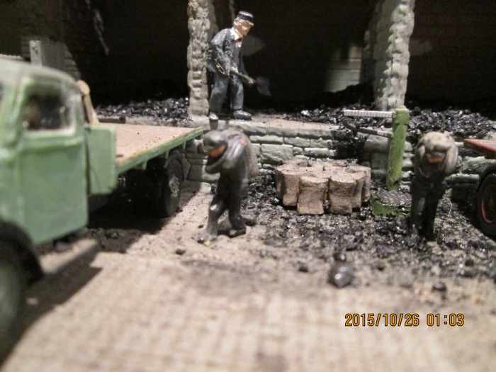 loading up the delivery lorries prior to weighing and departure. The 'Clean Air Act' of 1956 would gradually lead to smoke-free zones and coal deliveries would give way to 'cleaner' fuels like oil and gas for central heating.