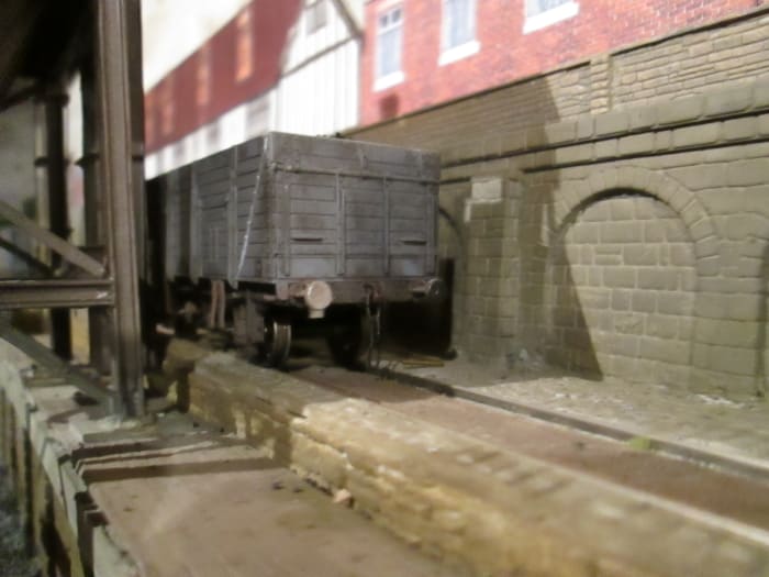 Empty Loco coal wagons stand at the head of the ramp behind the feeder, awaiting collection by the J94 0-6-0 Austerity saddle tank (ST) locomotive